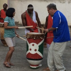 Al and Dave learning new skills with the famous Drummers of Burundi, on a previous trip to Africa.